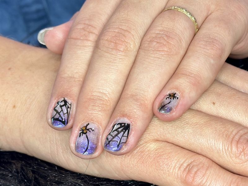 Hand-painted spider web nail art